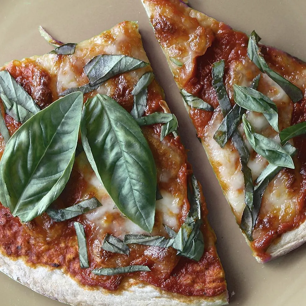 Handcrafted pizza with fresh ingredients at Strathcona Pizza in Edmonton, AB